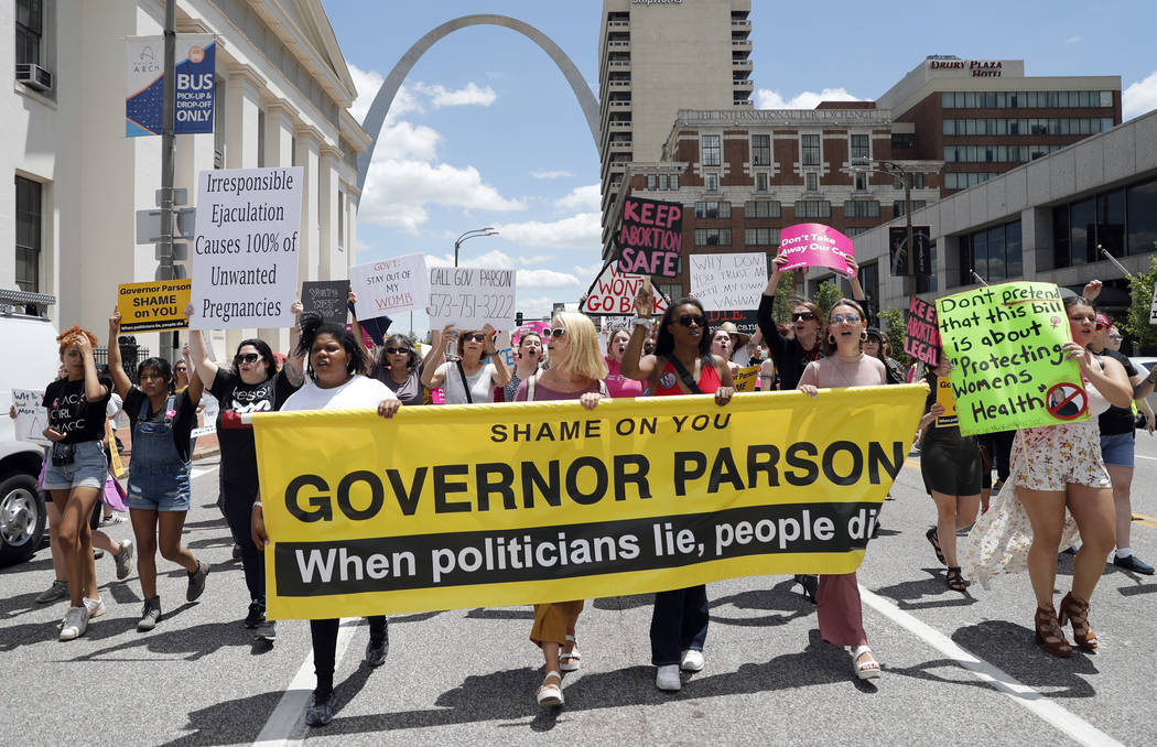 Abortion-rights supporters march Thursday, May 30, 2019, in St. Louis. A St. Louis judge heard ...