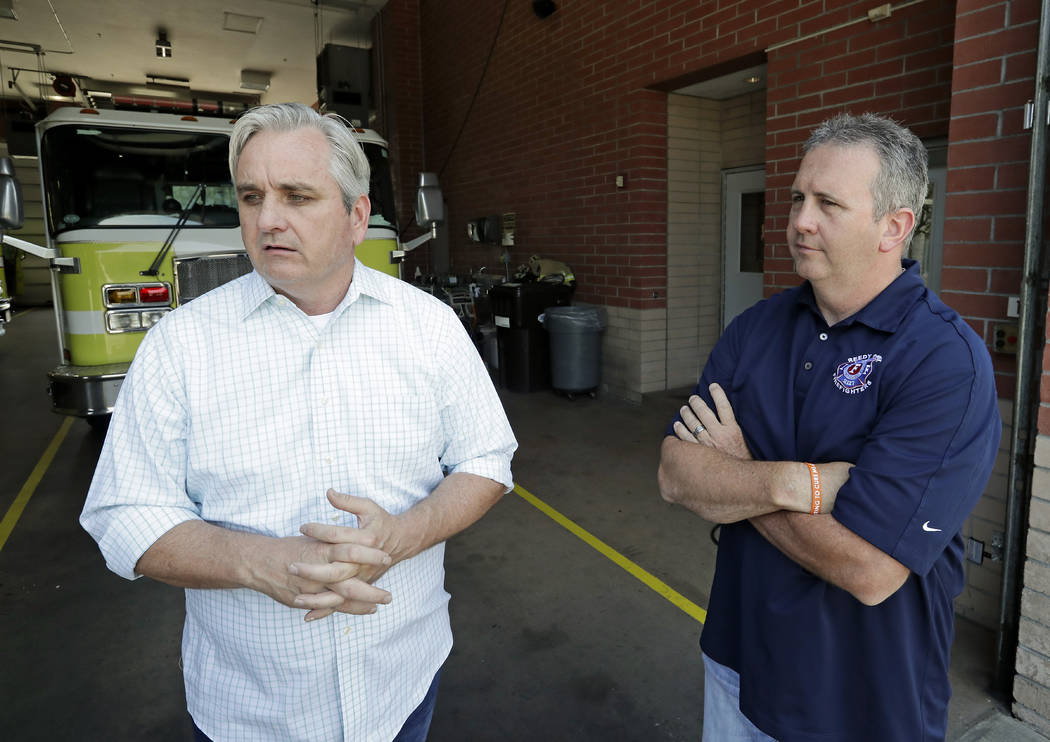 In this Tuesday, May 28, 2019 photo, Timothy Stromsnes, left, president of the Reedy Creek Prof ...