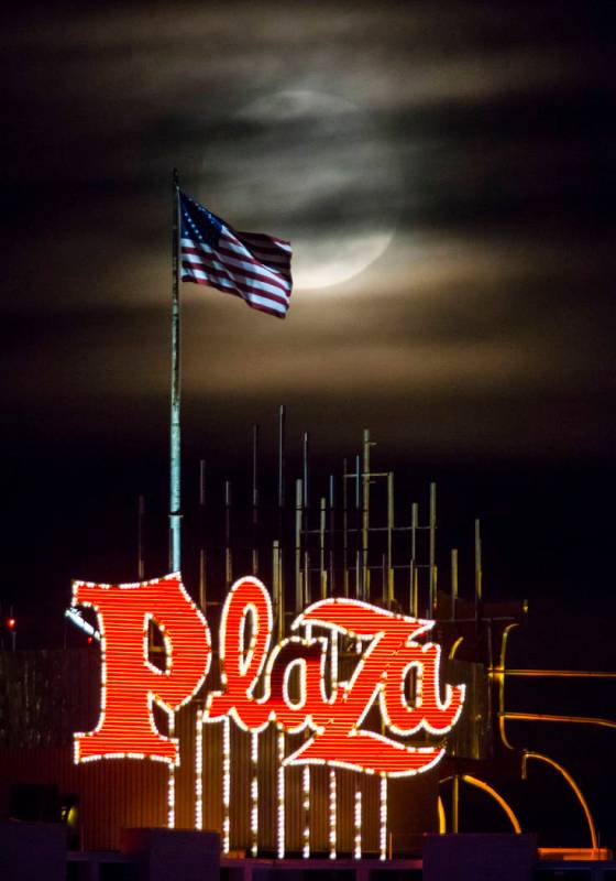 A super snow moon rises over the Plaza in downtown Las Vegas as seen from the World Market Cent ...