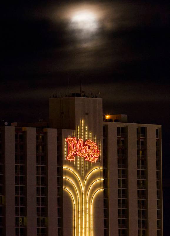 A super snow moon rises over the Plaza in downtown Las Vegas as seen from the World Market Cent ...