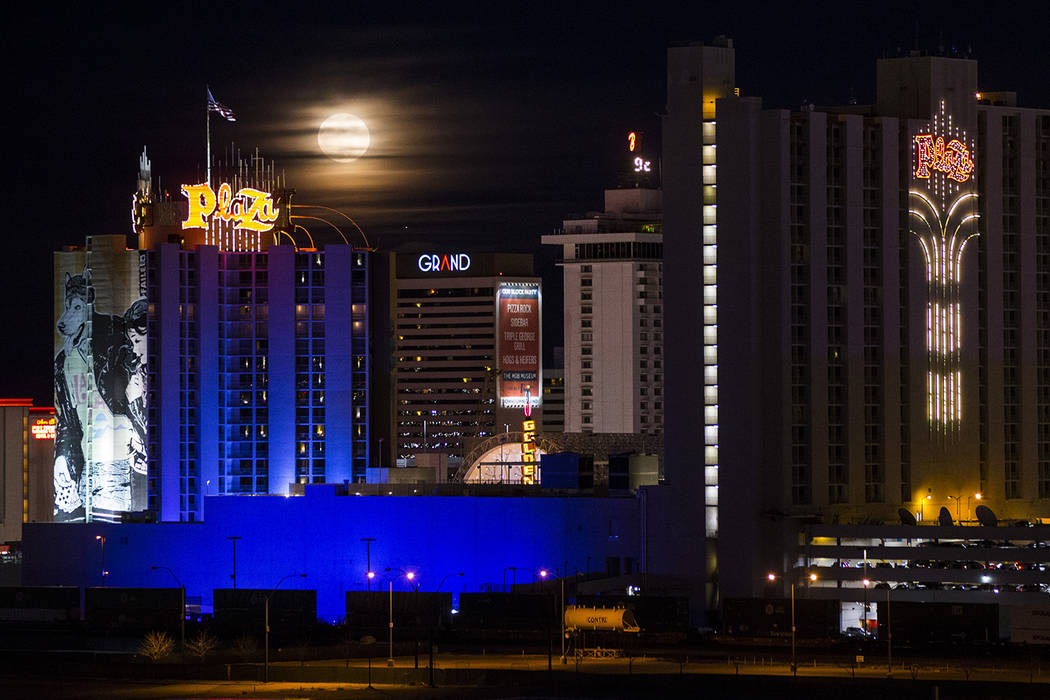 A super snow moon rises over the Plaza in downtown Las Vegas as seen from the World Market Cent ...