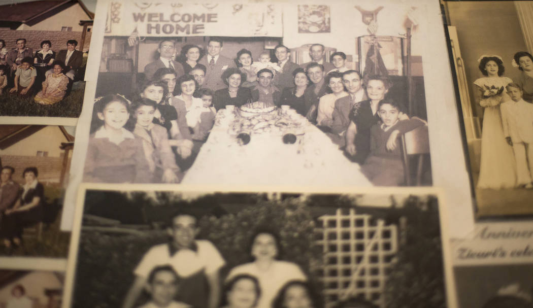 A photo of Onofrio "No-No" Zicari, center in front of the cake, at his party upon his ...