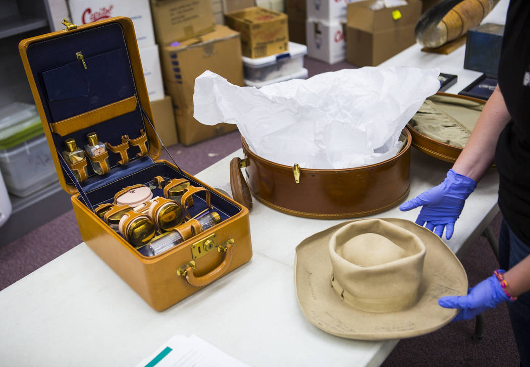 A variety of items, including Clara Bow's makeup kit, left, as well as a signed cowboy hat, fro ...