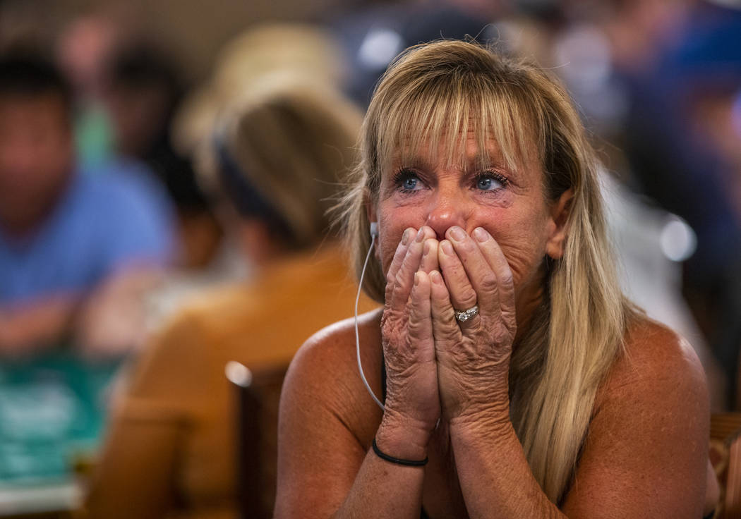 Kim Emmett, of Chicago, reacts as stakes get high during the The Big 50, a $500 buy-in, no-limi ...