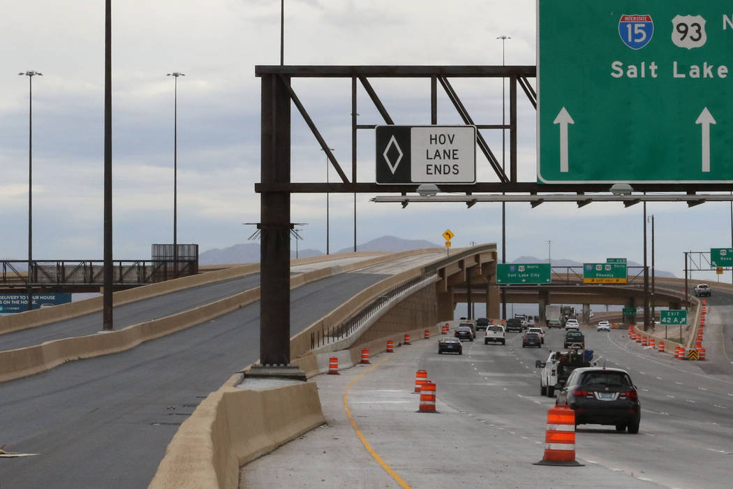 The newly completed Project Neon HOV flyover ramp in the Spaghetti Bowl, left, is seen on Thurs ...