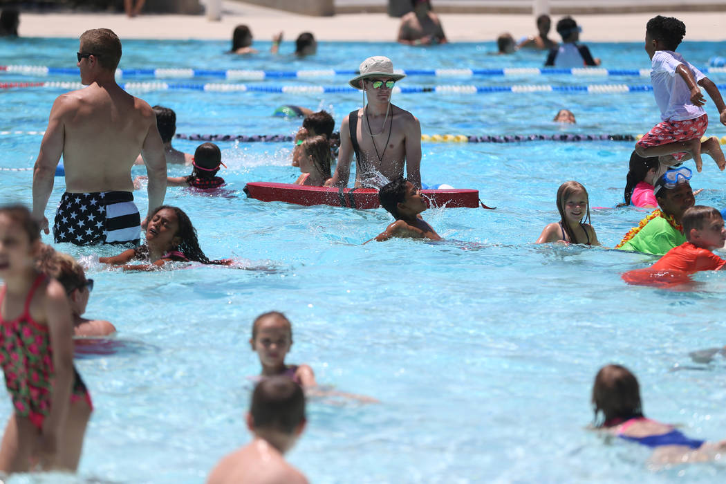 Swimmers splash in the pool during the annual Ward 4 Summer Splash at the Durango Hills Communi ...