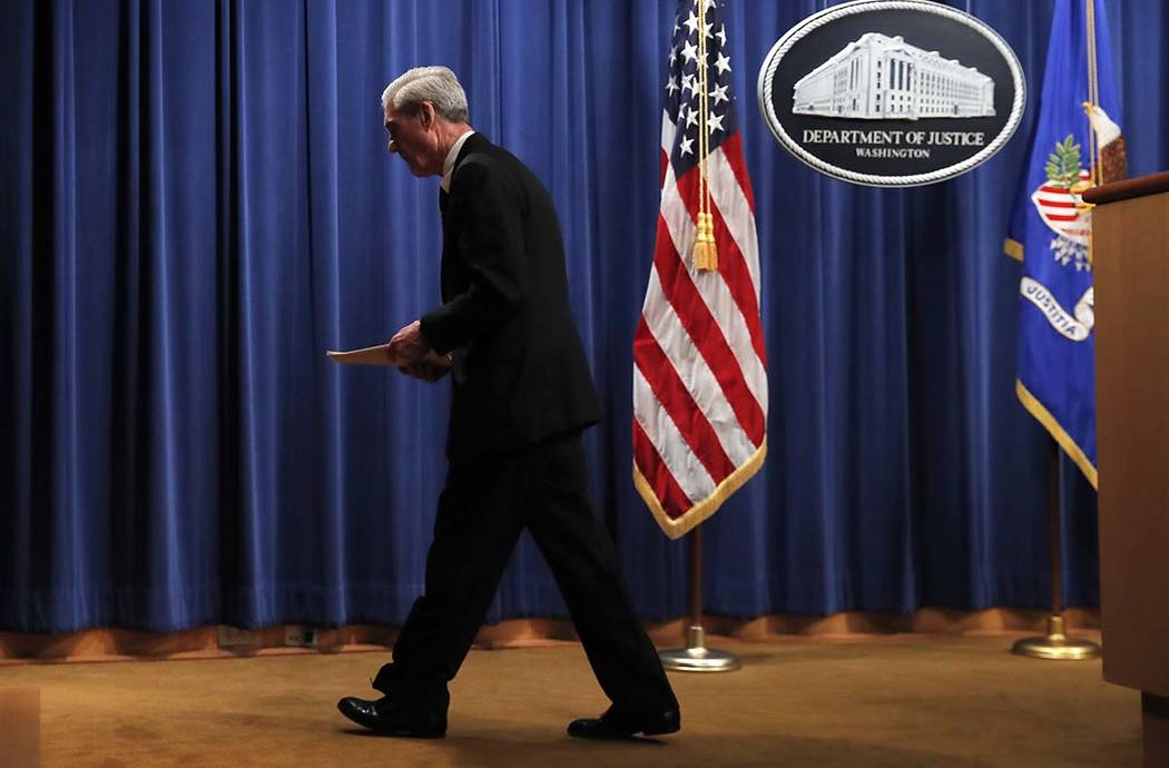 Special counsel Robert Mueller walks from the podium after speaking at the Department of Justic ...