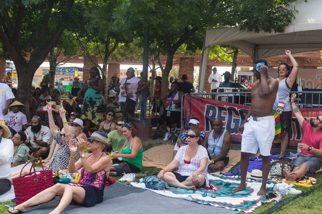 A crowd dances and sings to live reggae music at the Clark County Amphitheatre during Reggae in ...