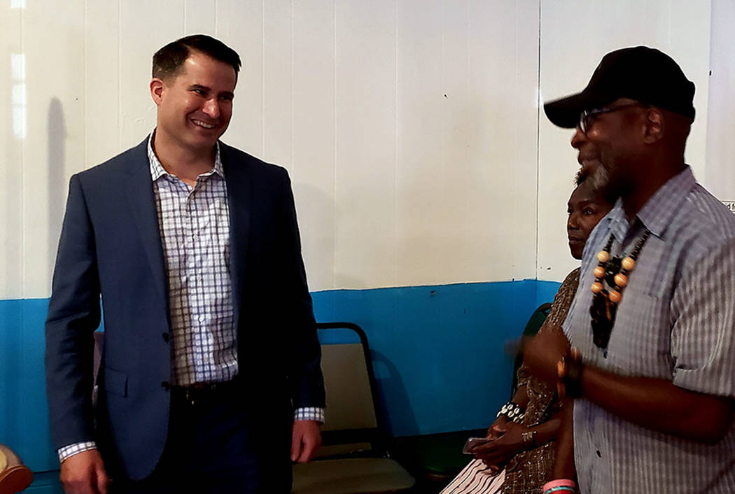 U.S. Rep. Seth Moulton, D-Mass, speaks to Rodney Smith, right, at a veterans town hall meeting ...