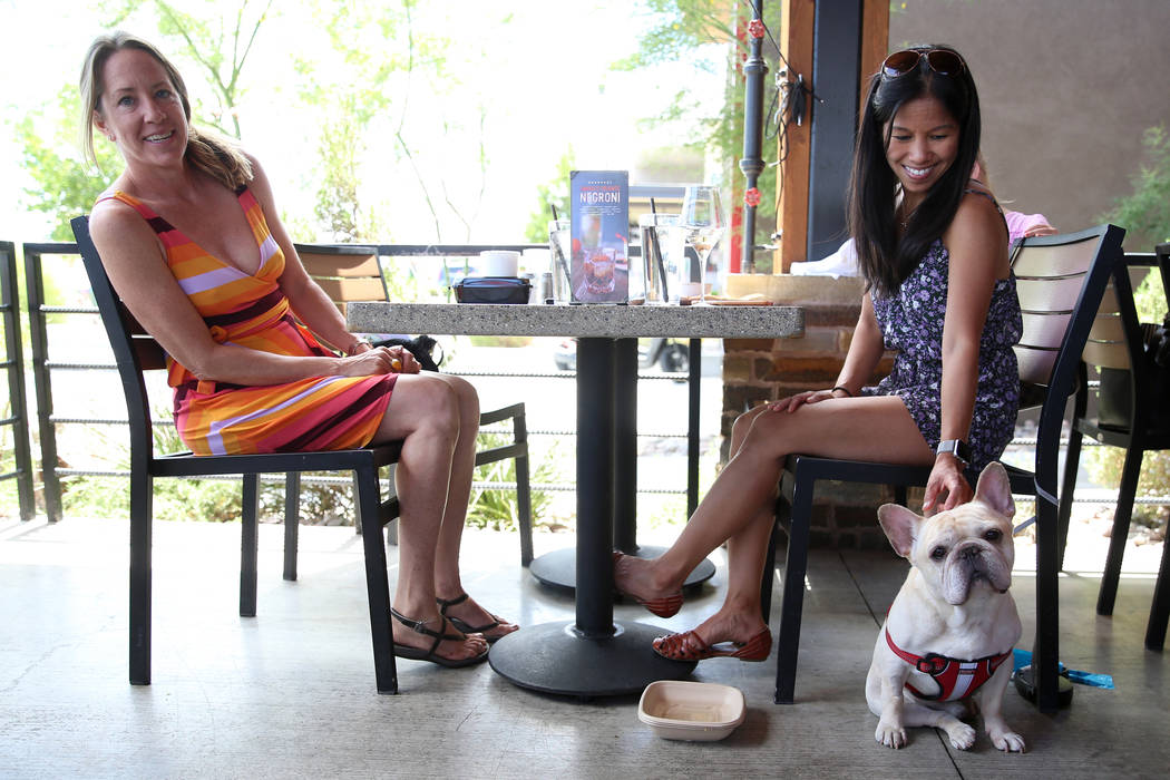 May Benda, right, with her dog Bruiser, has lunch with her friend Kara Frampton at Lazy Dog res ...