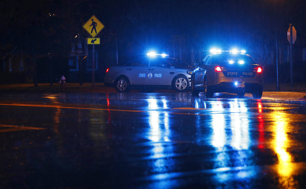 Virginia State Police vehicles block a street near the scene of a shooting at a municipal build ...