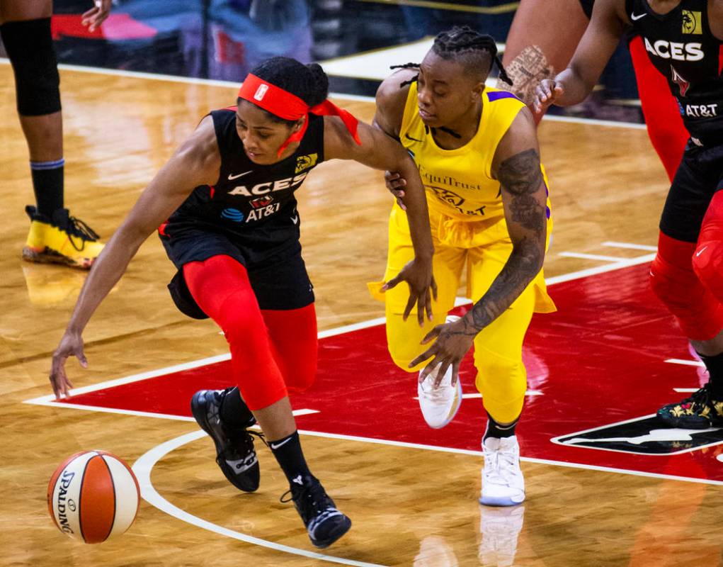 Las Vegas Aces guard Sydney Colson (51) steals the ball from Los Angeles Sparks guard Riquna Wi ...