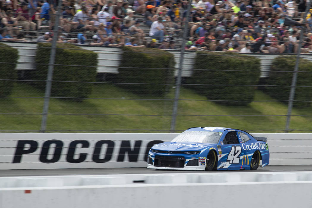 Kyle Larson drives down the front stretch during a NASCAR Cup Series auto race at Pocono Racewa ...