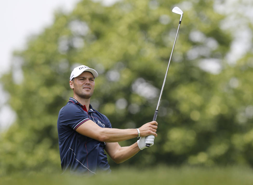Martin Kaymer, of Germany, watches his tee shot on the third hole during the final round of the ...