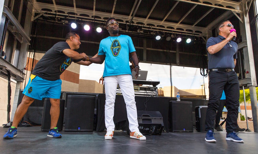 Las Vegas Lights FC assistant head coach Auggie Rodriguez greets hype man Robert "Bojo" Ackah a ...