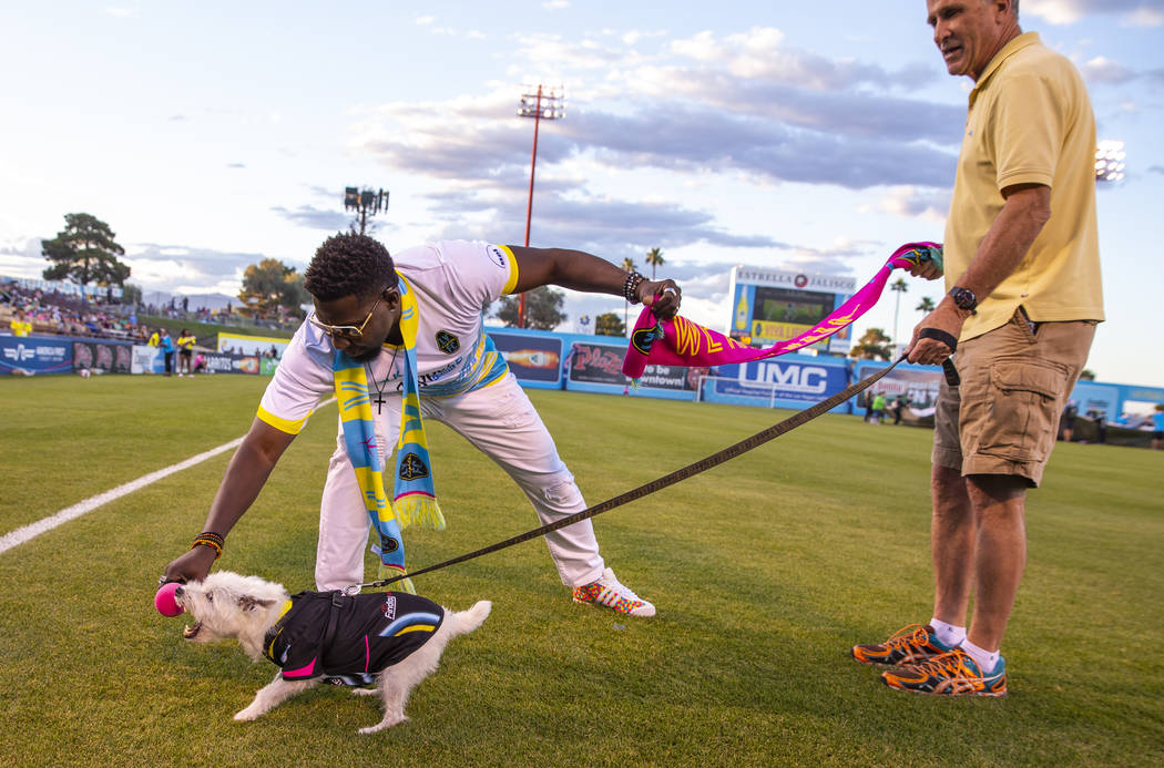 Bark-Andre Furry barks for the fans as Las Vegas Lights FC hype man Robert "Bojo" Ackah and Fur ...