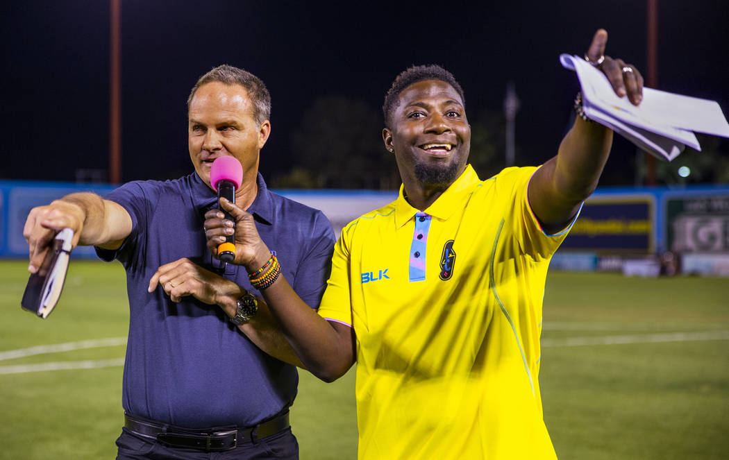 Las Vegas Lights FC head coach Eric Wynalda gives a halftime field interview with hype man Robe ...