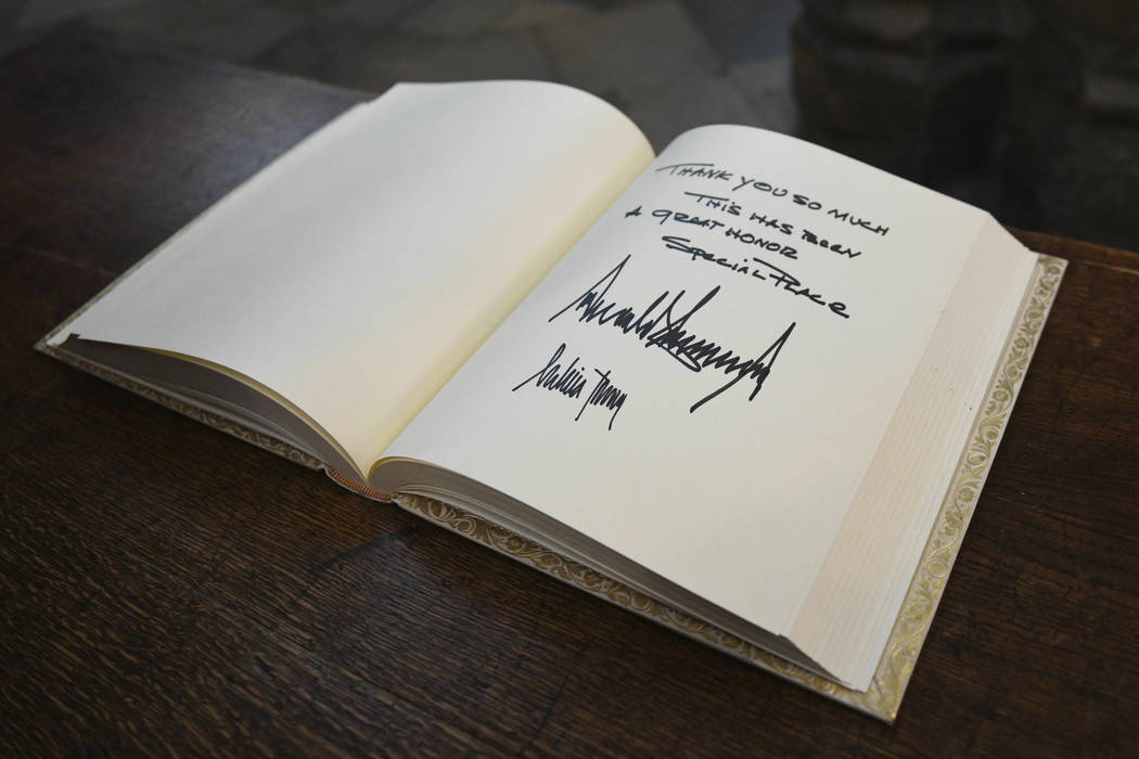 The visitors books signed by US President Donald Trump and his wife Melania after their tour of ...