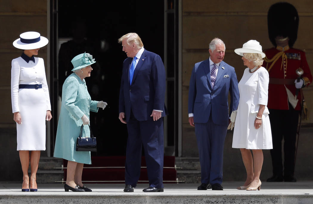 Britain's Queen Elizabeth II greets President Donald Trump, center, and first lady Melania Trum ...