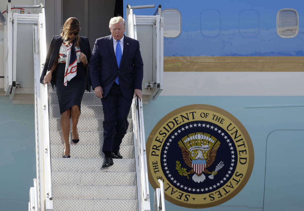 President Donald Trump and first lady Melania Trump arrive at Stansted Airport in England, Mond ...