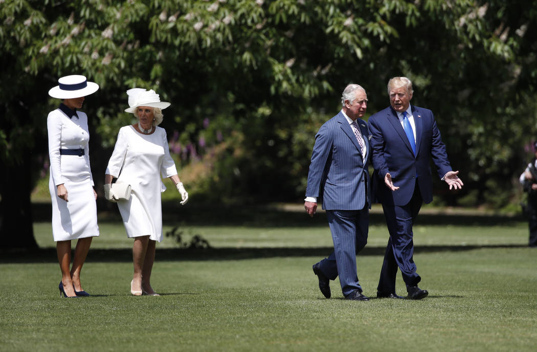 President Donald Trump walks with Prince Charles and first lady Melania Trump walks with Camill ...