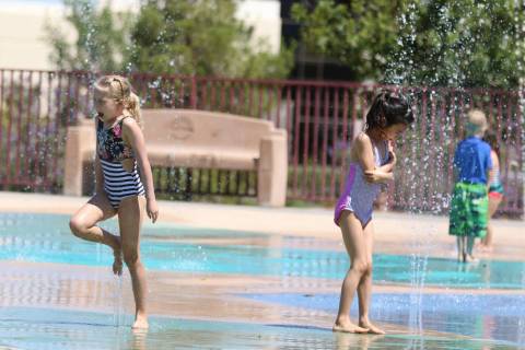 Maye Spann, 6, left, and her friend Stella Huang, 7, play at Paseo Vista Park on Monday, June, ...