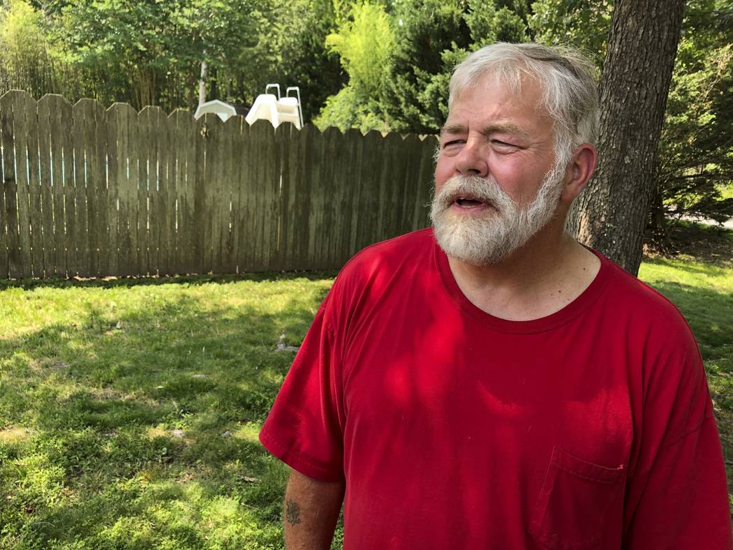 Terry Inman, 61 stands in his Virginia Beach, Va., backyard, Sunday, June 2, 2019, after survi ...