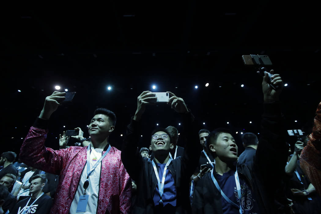 Attendees await the start of the keynote address at the Apple Worldwide Developers Conference i ...