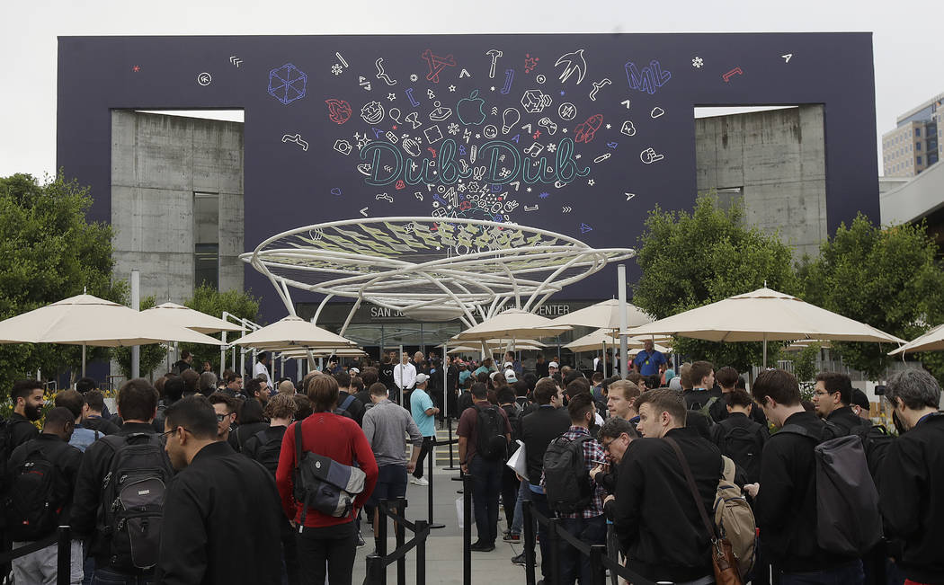 A crowd waits in line before an announcement at the Apple Worldwide Developers Conference in Sa ...