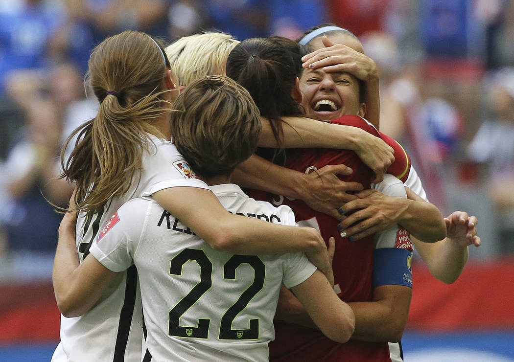 FILE - In this July 5, 2015, file photo, United States' Carli Lloyd, right, celebrates with tea ...