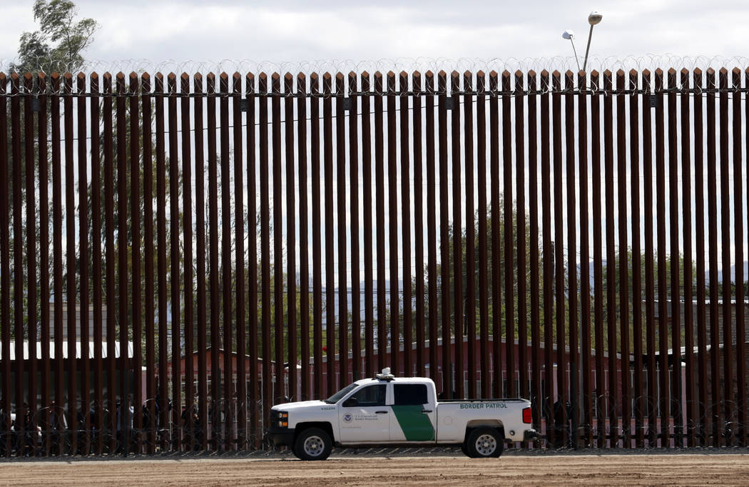 FILE - In this April 5, 2019, file photo, a U.S. Customs and Border Protection vehicle sits nea ...