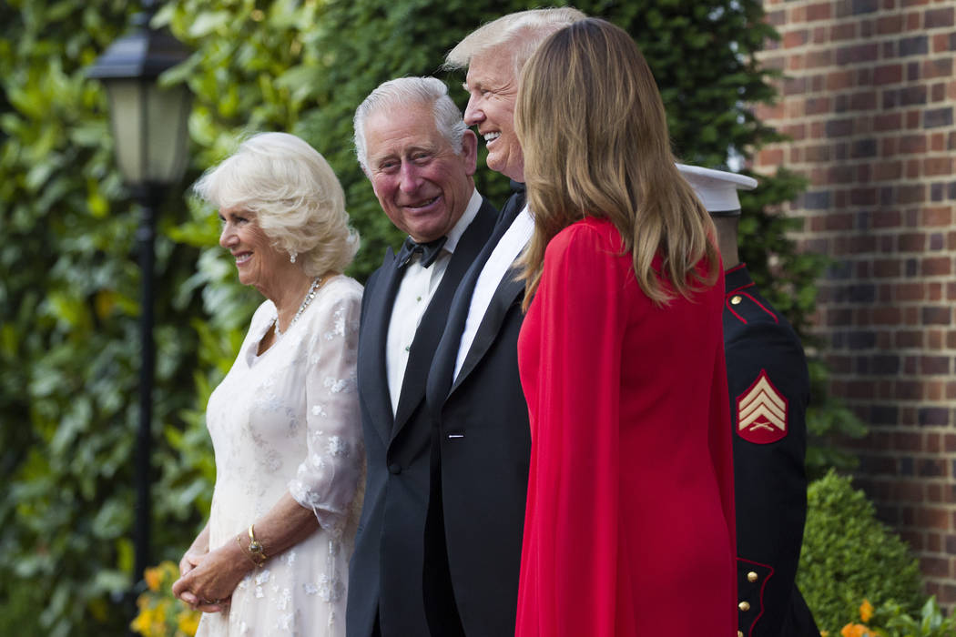 President Donald Trump and first lady Melania Trump pose for a photograph with Prince Charles, ...