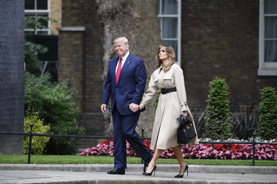 President Donald Trump and first lady Melania Trump walk to 10 Downing Street, Tuesday, June 4, ...