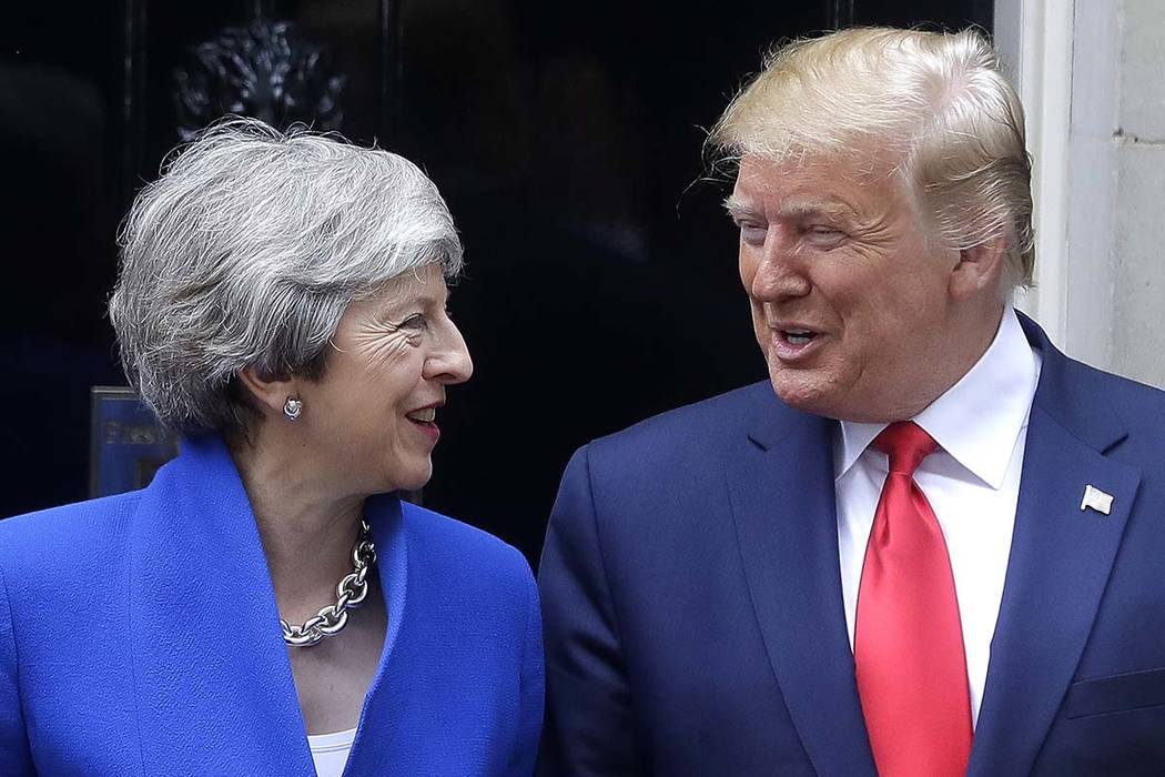 Britain's Prime Minister Theresa May greets President Donald Trump outside 10 Downing Street in ...