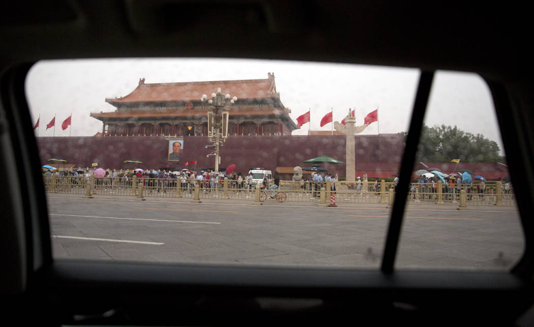 The large portrait of former Chinese leader Mao Zedong on Tiananmen Gate next to Tiananmen Squa ...