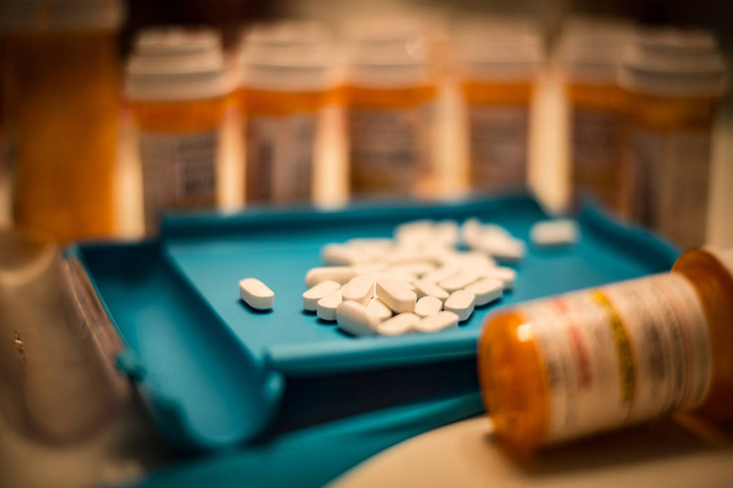 Unsorted prescription pills sit in a pharmacist's counting tray before they are bottled. (Getty ...