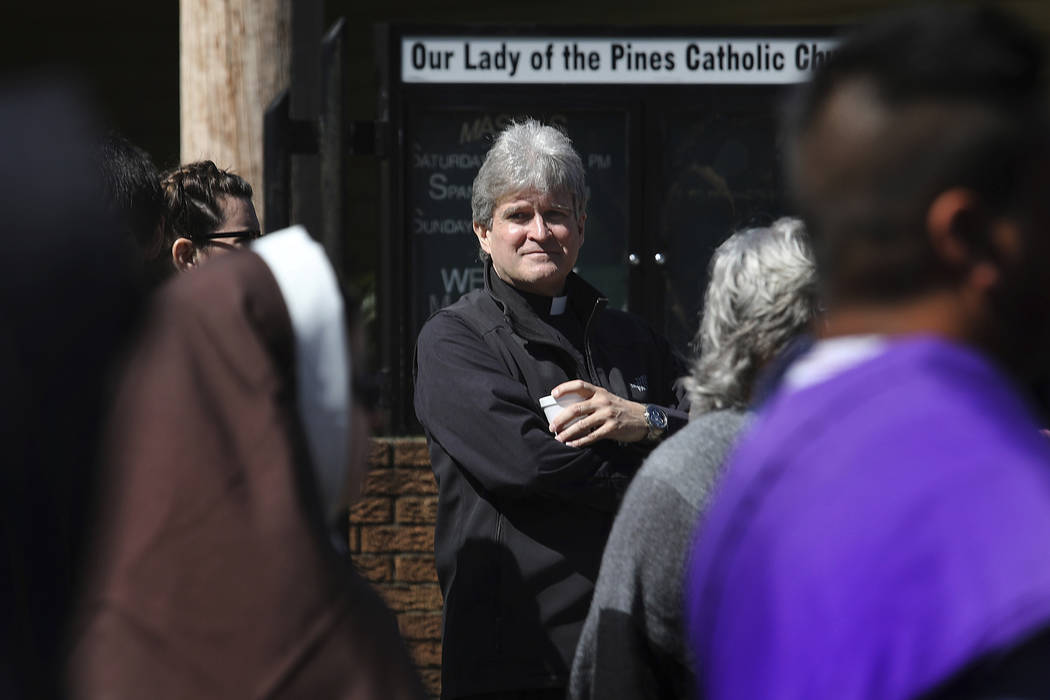 Monsignor Frank Rossi stands outside Our Lady of the Pines Catholic Church in Woodville, Texas, ...