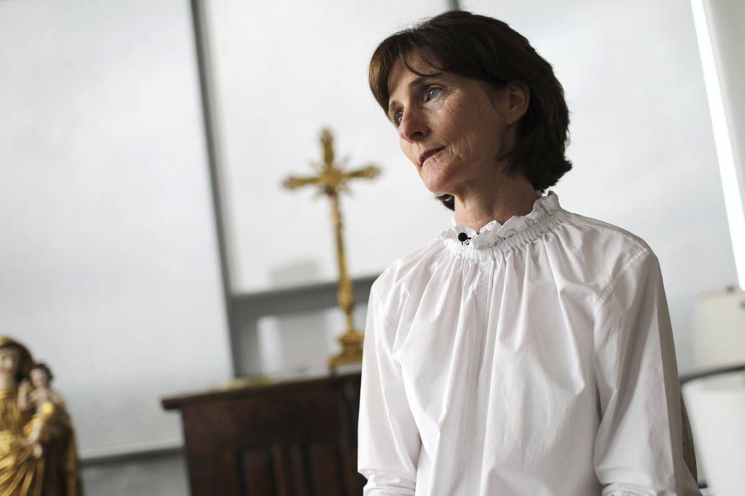 Laura Pontikes pauses during an interview in the prayer section of her apartment in Houston on ...