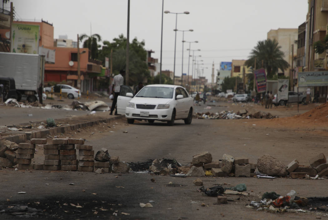 Bricks laid by protesters to block a main street in the Sudanese capital Khartoum to stop milit ...