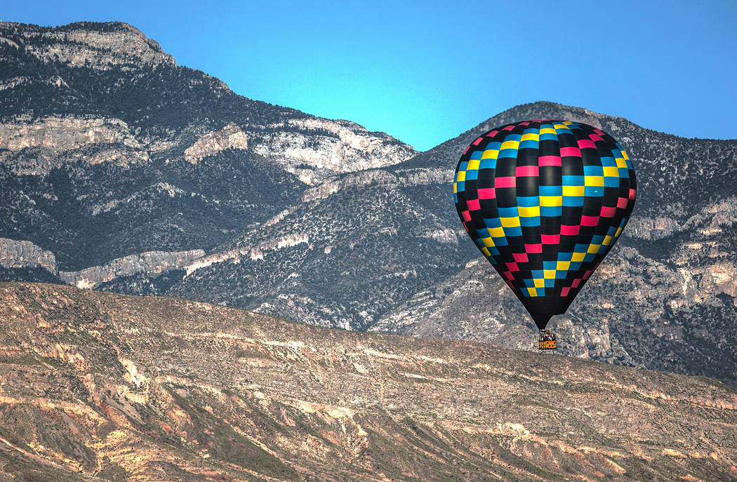 A hot air balloon passes over the southwest Las Vegas Valley on Wednesday, June, 5, 2019, in La ...