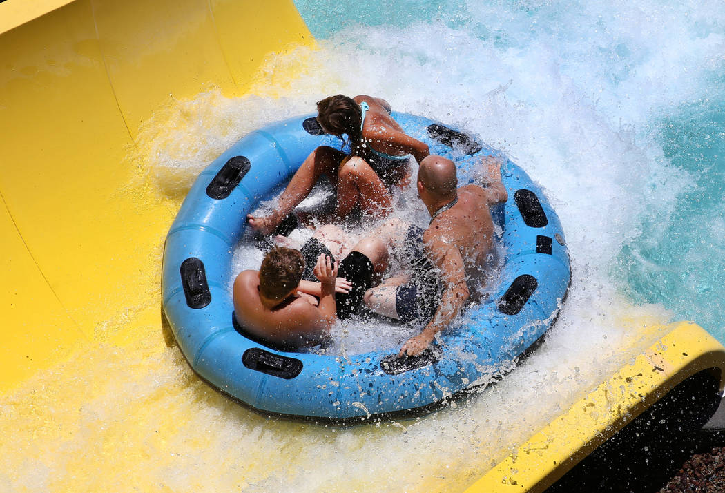 People enjoy a water slide at Cowabunga Bay Water Park in Henderson on Wednesday, June 5, 2019. ...