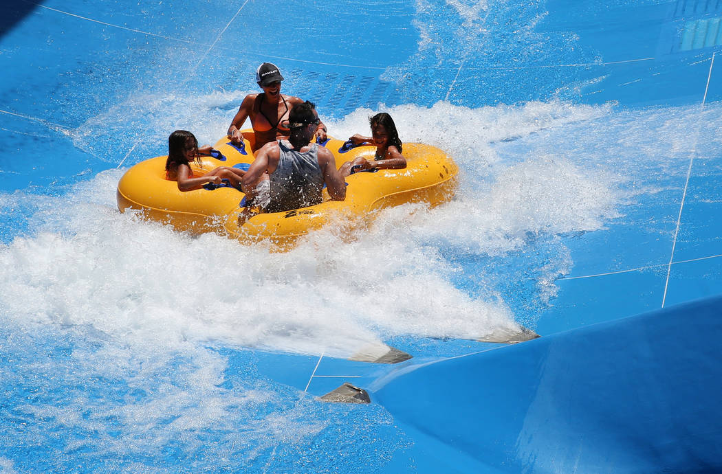 People enjoy a water slide at Cowabunga Bay Water Park in Henderson on Wednesday, June 5, 2019. ...