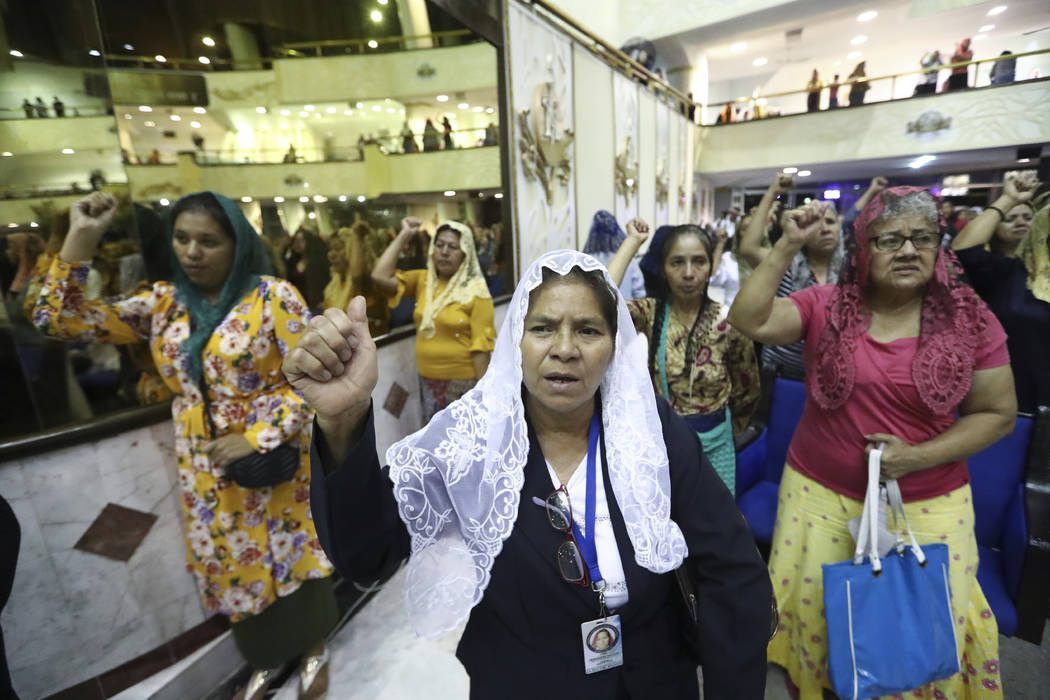 ADDS FIRST NAME - Women pray inside the "La Luz Del Mundo" or Light of the World chur ...