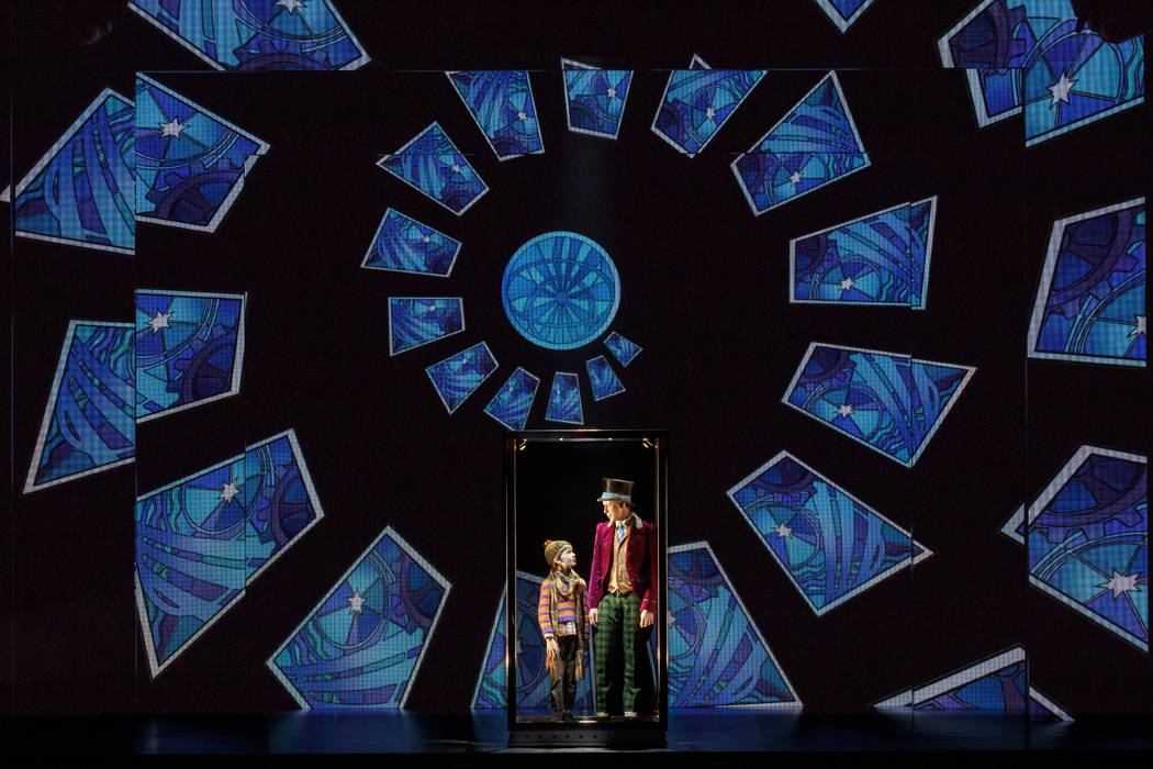 Henry Boshart as Charlie Bucket and Noah Weisberg as Willy Wonka. (Photo by Joan Marcus)