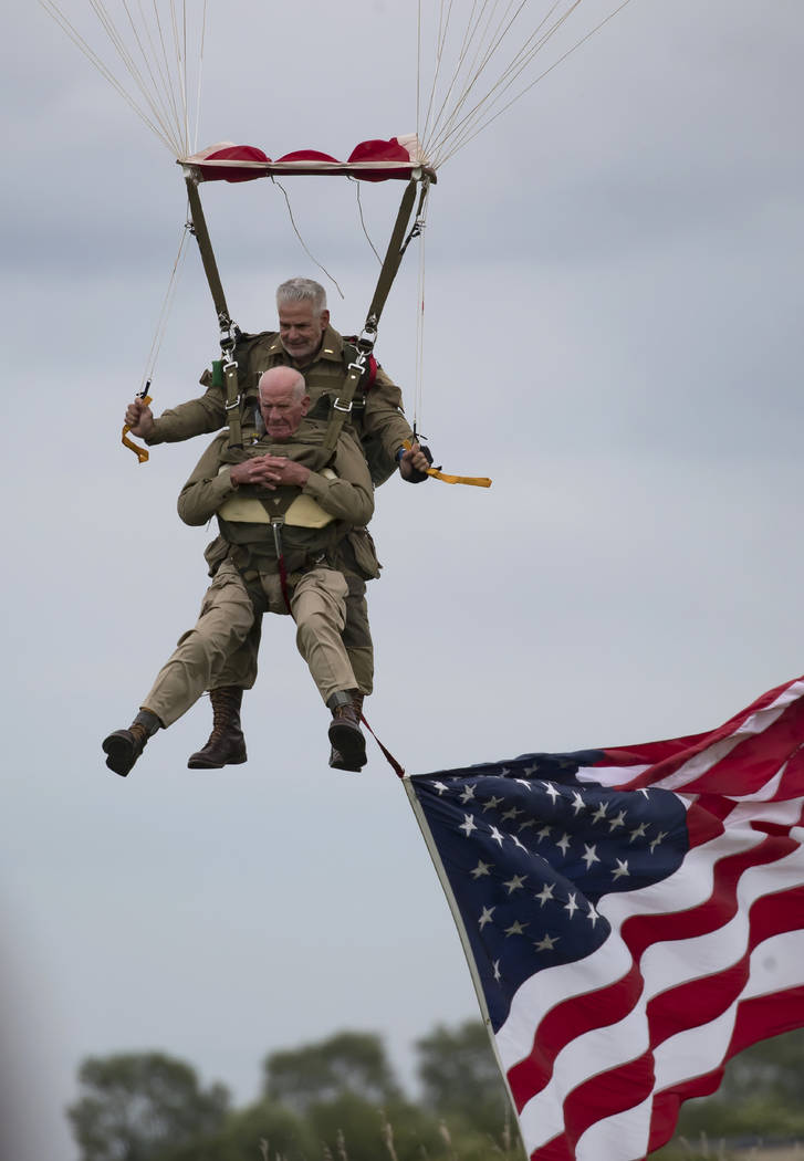 U.S. World War II D-Day veteran Tom Rice, from Coronado, CA, parachutes in a tandem jump into a ...