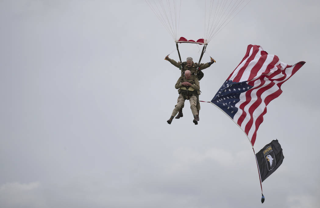 U.S. World War II D-Day veteran Tom Rice, from Coronado, CA, parachutes in a tandem jump into a ...