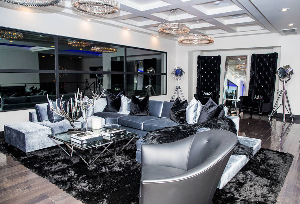 The upstairs loft is done in dramatic black, silver and gray. (Tonya Harvey Real Estate Millions)