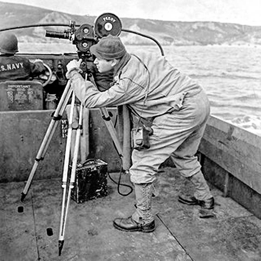 Army soldier and photographer Burton "Bud" Hartman and his camera during D-Day in World War II, ...