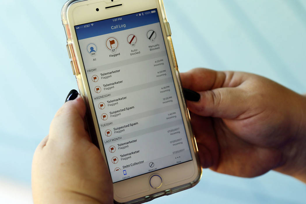 A call log is displayed via an AT&T app on a cellphone in Orlando, Fla. (AP Photo/John Raoux)
