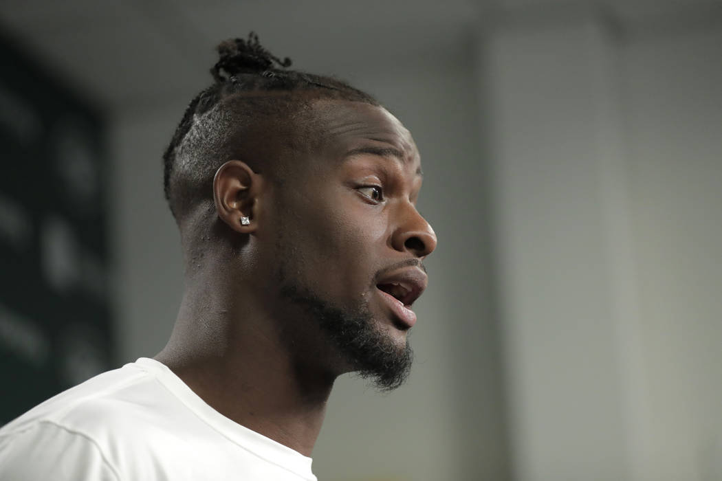 New York Jets running back Le'Veon Bell speaks to reporters at the team's NFL football training ...